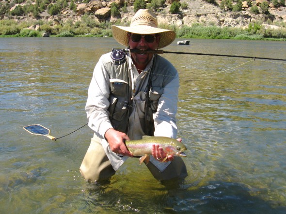 fisherman showing off a nice trout