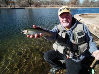 Tim McCarthy, 60, of Albuquerque, enjoys some mid-winter, catch and release fishing at Sandia Lakes.