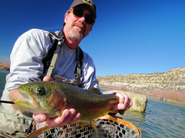 Mark Wethington, Fisheries Biologist for the New Mexico Department of Game and Fish (NMDGF) shows off a nice Rainbow trout caught in revitalized Braids section of the San Juan River.
