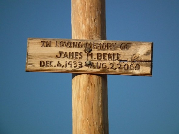 Wooden memorial sign.